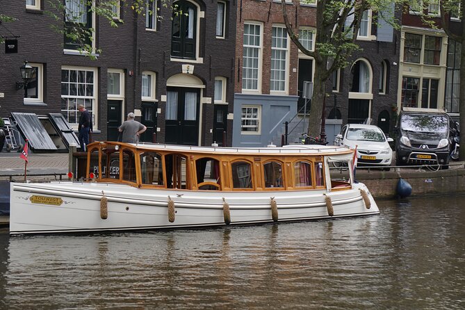 Eating Amsterdam: Food Tour and Canal Cruise - Taking in Dutch Culture