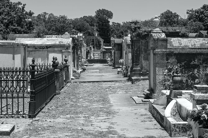 New Orleans Cemetery Bus Tour After Dark - Guide Highlights