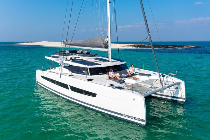 Semi-Private Brand-New Catamaran Cruise in Mykonos With Meal, Drinks & Transport - Onboard Amenities and Inclusions