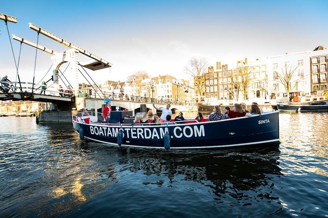 Amazing Open Boat Amsterdam Canal Cruise With Two Drinks Incl. - Included Drinks and Amenities