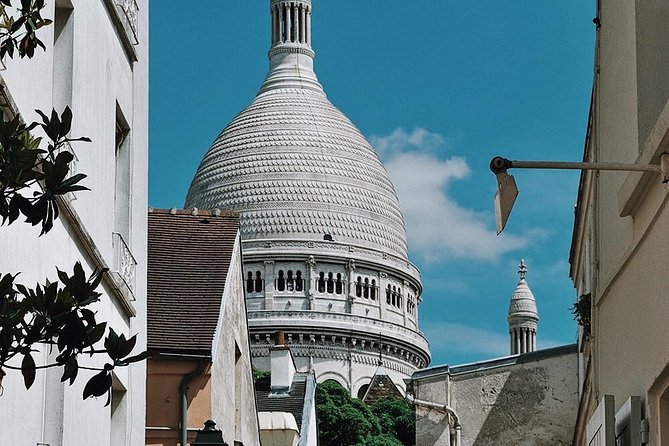 Montmartre District and Sacre Coeur - Exclusive Guided Walking Tour - Uncovering the Neighborhoods History