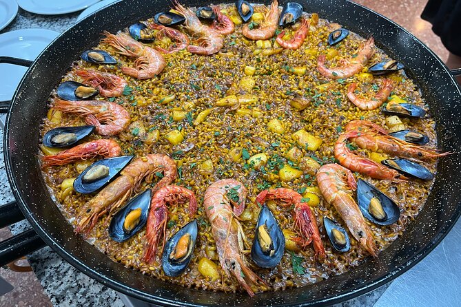 Seafood Paella Cooking Class, Tapas and Visit to Ruzafa Market. - Preparing the Paella