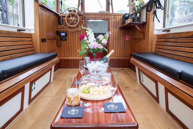Amsterdam Small-Group Canal Cruise With Dutch Snacks and Drink - Booking and Pricing