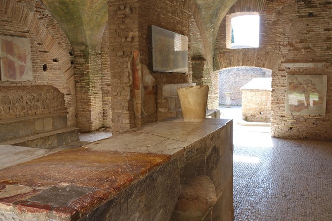 Ancient Ostia Antica Semi-Private Day Trip From Rome by Train With Guide - Exploring the Ruins of Ostia Antica