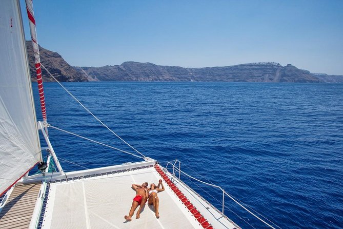 Sailing Catamaran Cruise in Santorini With BBQ, Drinks and Transfer - Booking and Cancellation Policy