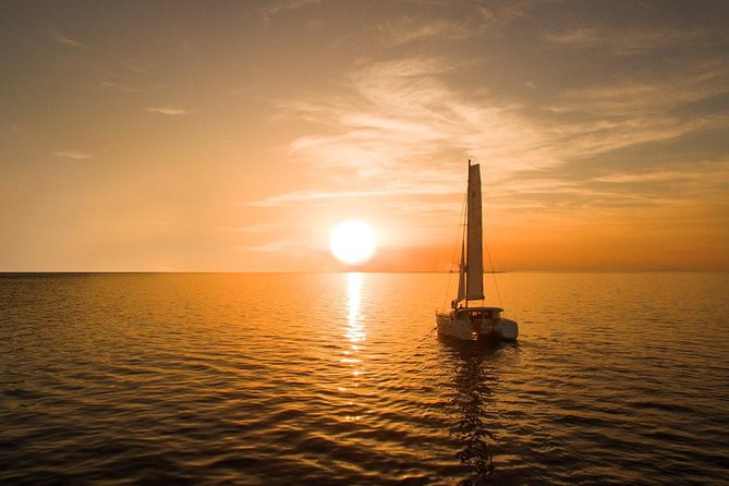 Santorini Luxury Catamaran Sunset Cruise With BBQ, Drink and Transfer - Enjoying the Greek BBQ Meal and Beverages