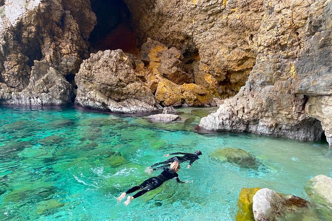 Kayak Paradise: Cala Portixol Snorkel, Cave & Cliff Jumping Tour - The Thrill of Cliff Jumping