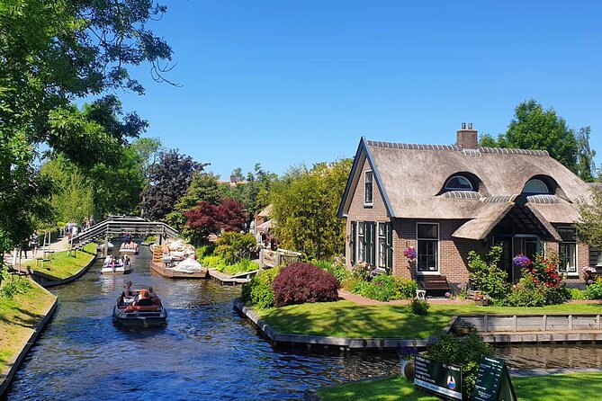 Giethoorn and Zaanse Schans Small Group Day Tour With Small Boat - Key Points