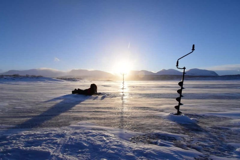 Abisko: Ice Fishing Experience - Learning How to Drill Holes and Use Equipment