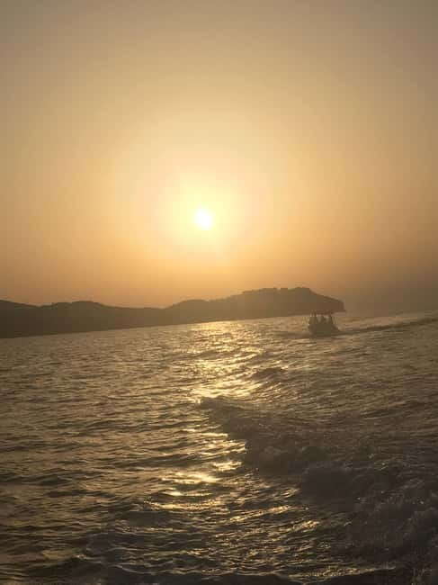 Agia Pelagia: Sunset Motorboat Tour with Soft Drinks - Departing from Blue Water Club in Agia Pelagia