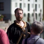 Alesund: Viking Tour with Ship Experience and Tasting - Climbing Aboard a Genuine Viking Ship in Ålesund’s Brosundet Channel