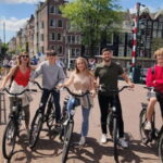 Amsterdam bike tour with a French-speaking guide local! - Highlighted Stops: Anne Frank House, Grachtengordel, and De Negen Straatjes