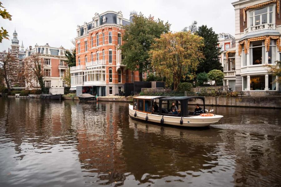 Amsterdam Canal Boat Tour with Live Guide - Comfortable and Weather-Ready Boat Setup