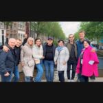 Amsterdam: Day City tour with local Guide in German - Walking Through Dam Square and the Royal Palace