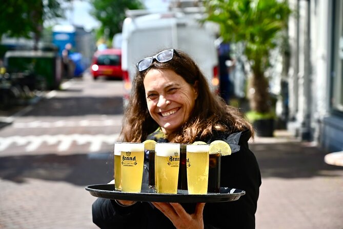 Amsterdam Food Tour in Jordaan District With Secret Food Tours - Visiting Top Landmarks: The Westertoren and a Memorial