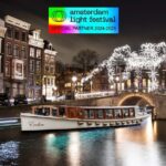 Amsterdam Light Festival: Canal Cruise Covered Saloon Boat - Inside the Covered Saloon Boat Experience