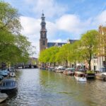 Amsterdam Walking Tour and Canal Cruise - Visiting a Famous Local Street Market