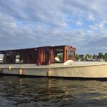 Amsterdam: Zaanse Schans Private Boat Tour with Guide - Free Time for Personal Exploration and Shopping