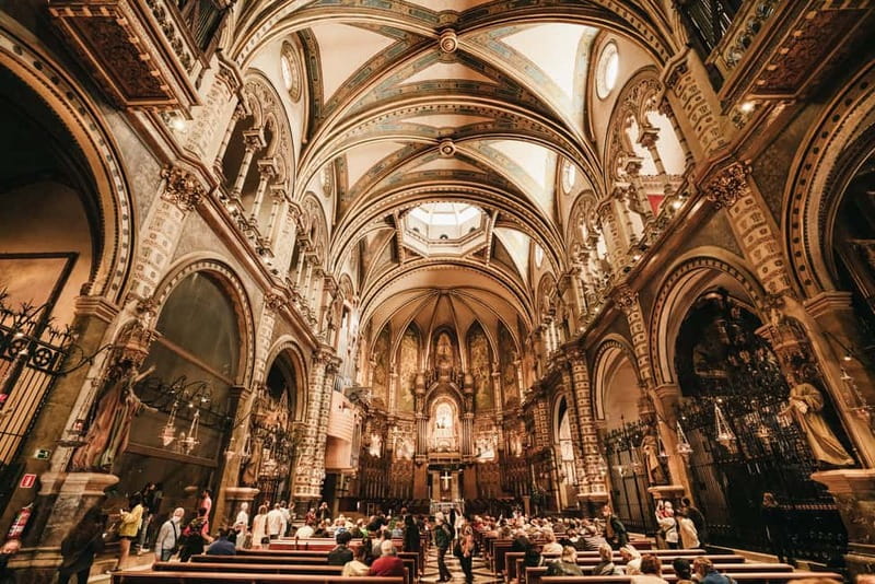 Barcelona: Montserrat, Cogwheel, Black Madonna & Winery Tour - Inside the Montserrat Monastery: Art, Faith, and History