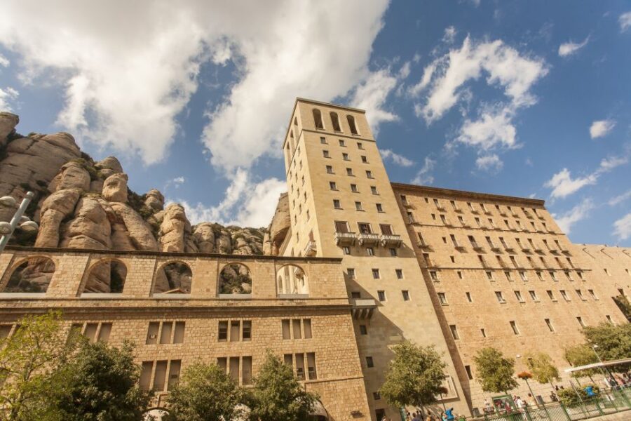Barcelona: Montserrat with Winery Visit and Farmhouse Lunch - Exploring Montserrat Monastery and Its Sacred Atmosphere
