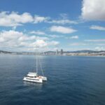 Barcelona: Shared cruise on a catamaran Drink+Local Tapa - Exploring Barcelona’s Landmarks from the Water