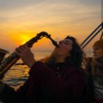 Barcelona: Sunset Live Sax and Sailing Experience with Tapas - Starting Point and Check-In at Port Olimpic