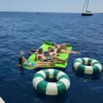 Catania: Sunset Sailing with Aperitif and Swim (4 hours) - Exploring the Scenic Stops: Ulysses Caves and Aci Castello