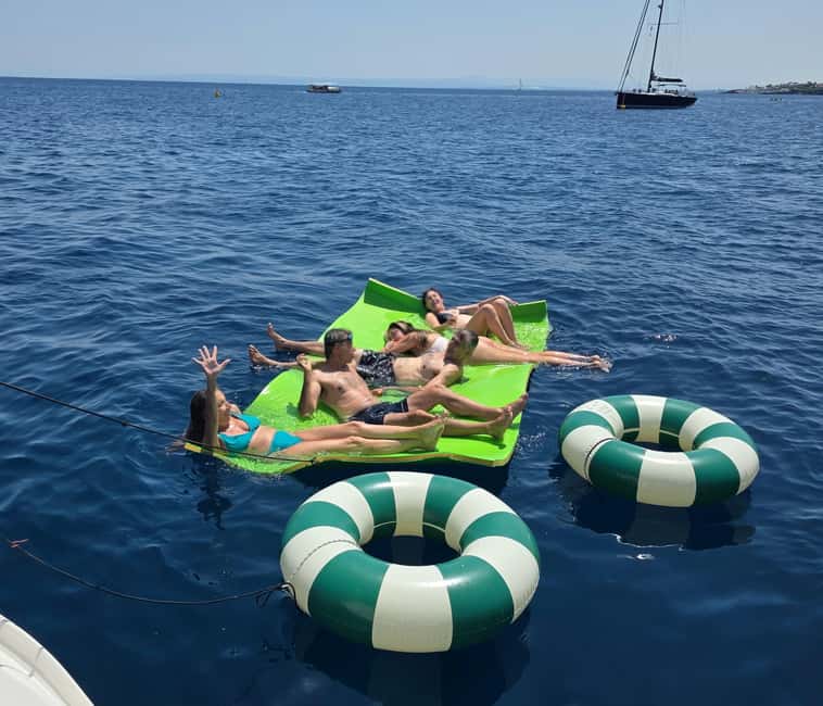 Catania: Sunset Sailing with Aperitif and Swim (4 hours) - Exploring the Scenic Stops: Ulysses Caves and Aci Castello