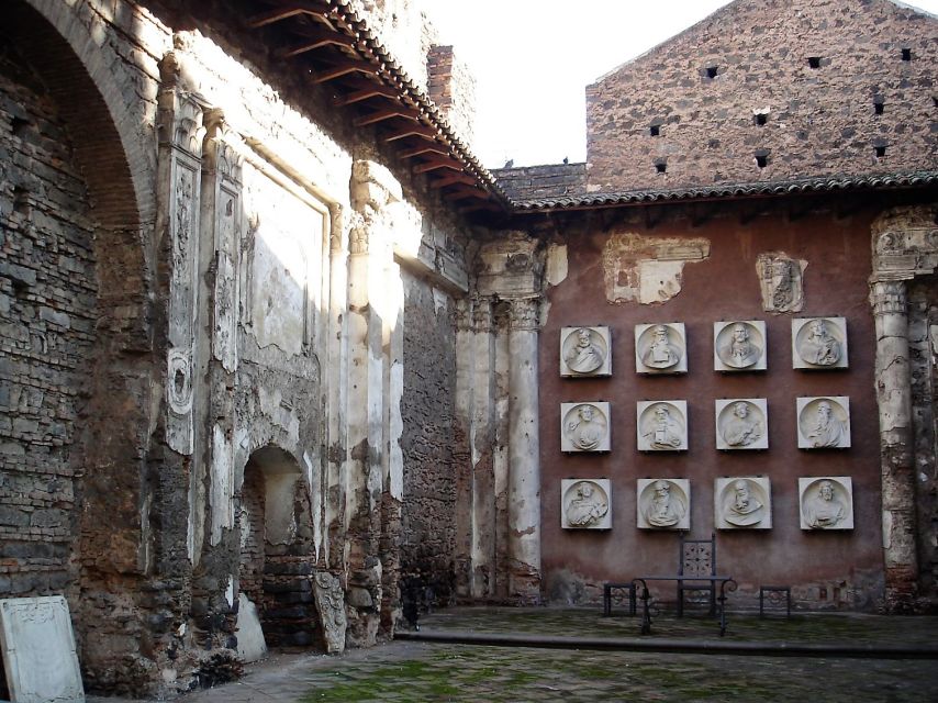 Catania: Underground and Street Food Walking Tour - Exploring the Roman Amphitheater and Underground Caves