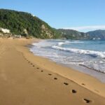 Corfu: A relaxed day at Glyfada Beach - Glyfada Beach: A Natural Beauty with Clear Waters and Pine Hills