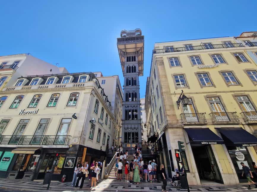 Discover Lisbon: Walking Tour of Baixa, Bairro Alto & Alfama - Discovering the Praça do Comércio and Baixa’s Architectural Marvels