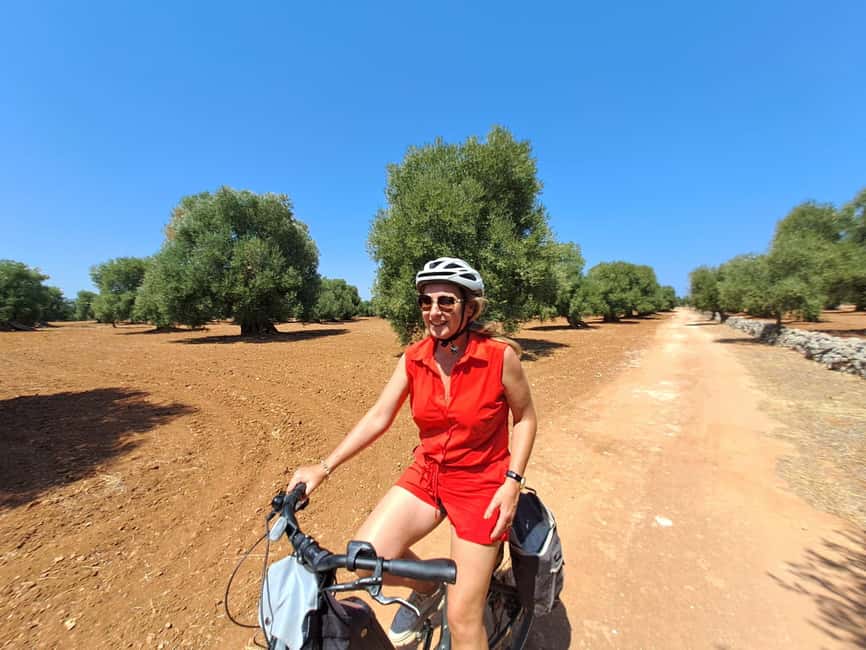 E-Bike Tour in Ostuni. Huge olive trees and a rock village - Visiting a Rock Village Rich in History