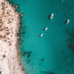 Explore Formentera with a Full-Day Private Sailboat Trip - Es Pujols and the Cliff-Jumping Adventures