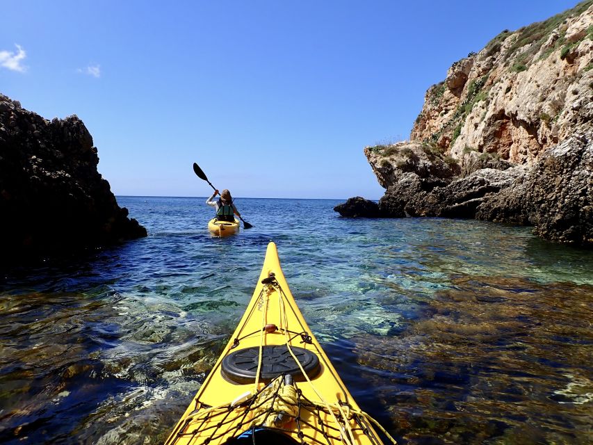 Favignana: kayak excursion, snorkelling and adventure - Starting Point on Favignanas Small Beach with a Yellow Off-Road Vehicle