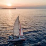 Fornells: Catamaran Sunset Cruise of Menorca's Coast - Sailing Out from Fornells Village