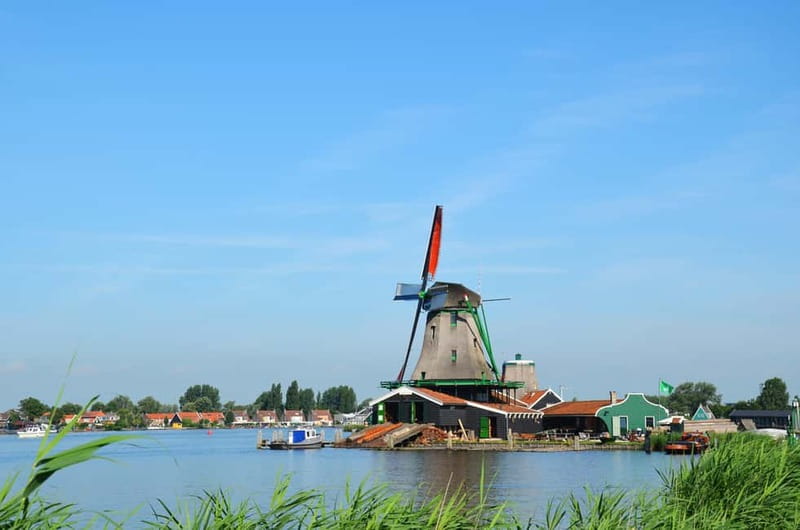 From Amsterdam: Dutch Windmills, Cheese and Wooden Shoes - From the Historic Windmills of Zaanse Schans to the Picturesque Village of Volendam