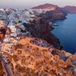 From Fira: Santorini Highlights Minibus Tour with Oia Sunset - Discovering the Charm of Megalochori Village