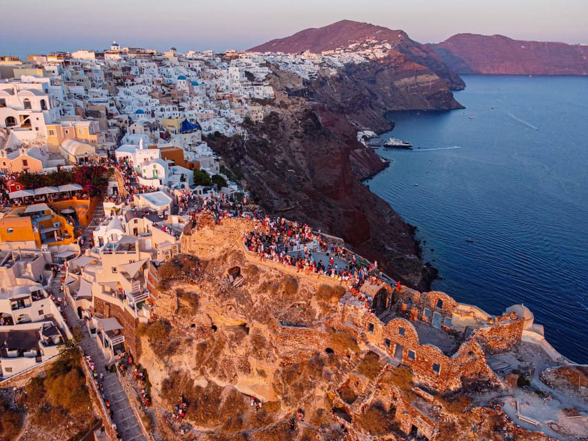 From Fira: Santorini Highlights Minibus Tour with Oia Sunset - Discovering the Charm of Megalochori Village