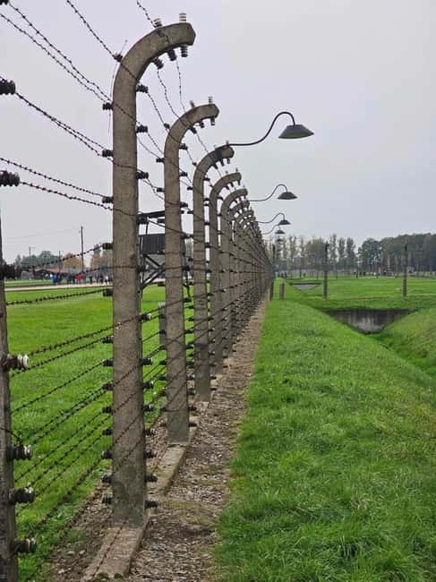 From Krakow: Auschwitz-Birkenau Guided Tour with Pickup - Visiting Auschwitz I: The Original Camp Site