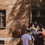 From Krakow: Auschwitz-Birkenau Live Guided Tour & Pickup - Visiting Auschwitz I: The Original Campsite