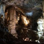 From Ljubljana: Postojna Cave & Predjama Castle Guided Trip - Predjama Castle: A Unique Cliffside Fortress