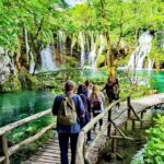 From Split: Plitvice Lakes Guided Tour with Entry Tickets - Exploring the Park by Boat, Train, and Foot