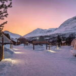 From Tromsø: Snowmobiling at Camp Tamok & Snow Park Visit - From Tromsø to the Remote Wilderness of Camp Tamok