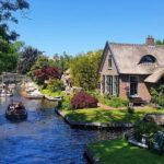 Giethoorn Day Tour from Amsterdam with Small Boat Ride - Electric Boat Ride: Cruising Giethoorn’s Canals