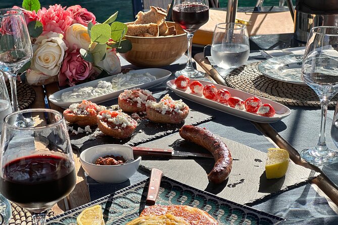 Greek Gastronomy & Wine Pairing Cruise with a Sommelier in Athens - Exploring the Stop at Ydrousa and the Saronic Gulf Waters