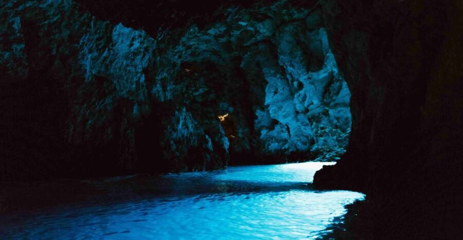 Hvar: Blue and Green Caves Boat Tour with Stiniva Beach - Exploring the Green Caves Greenish Luminescence