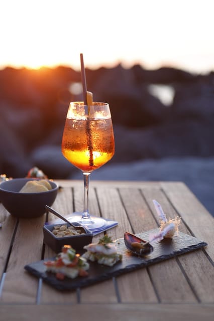 Italian aperitif at the sunset by the sea - What Makes This Aperitif Experience Special