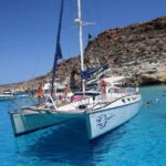 Lampedusa: PRIVATE catamaran tour with massage service - Starting Point: Easy Access at the Port in Lampedusa