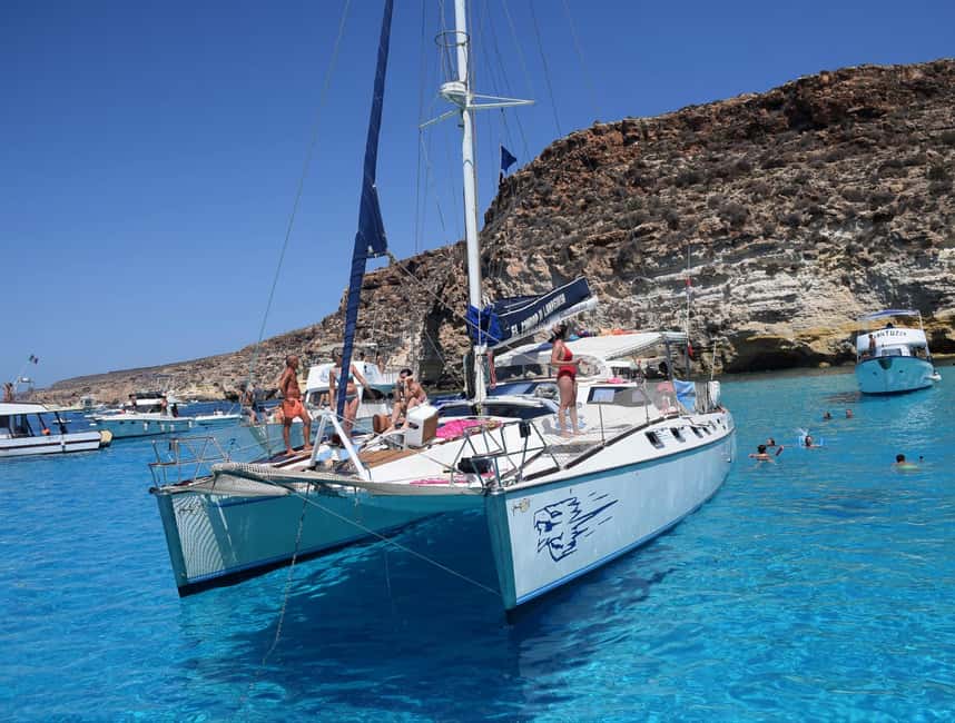 Lampedusa: PRIVATE catamaran tour with massage service - Starting Point: Easy Access at the Port in Lampedusa