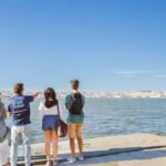 Lisbon Hidden Gems Walk: Traditions, Lunch & Ferry Ride - Exploring Rossio Square and the Downtown Charm of Baixa de Lisboa